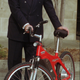 Lee Iacocca showing off a prototype EV Global bicycle in 1998.
